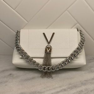Small leather handheld Valentino by Mario bag with silver chain.